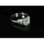 A modern platinum and single stone diamond ring centre with fancy and round cut diamond set