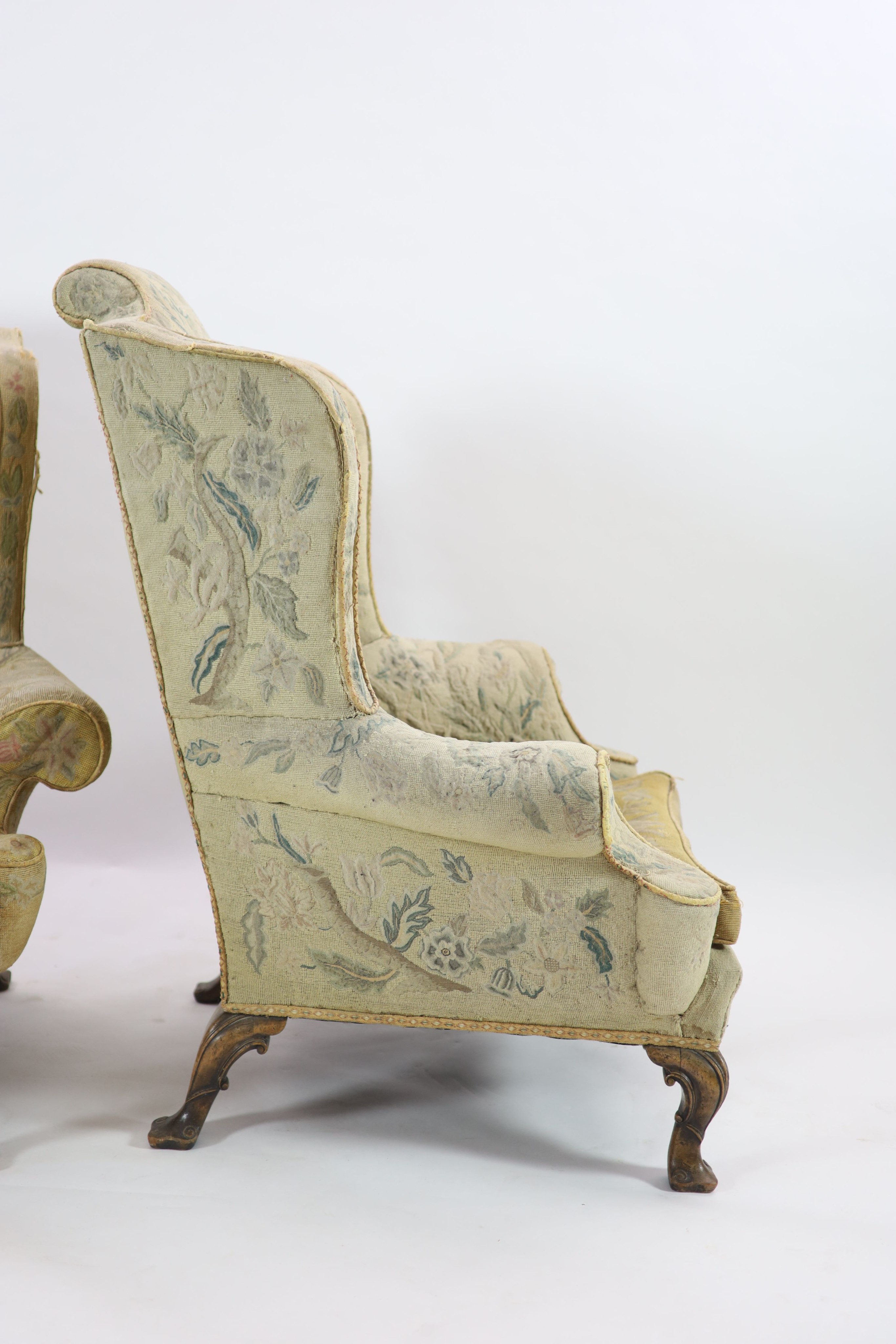 A pair of Georgian style mahogany wing armchairsof generous proportions, upholstered in faded - Image 6 of 6