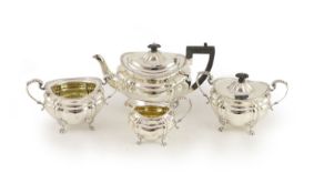 A late Victorian four-piece silver tea set comprising teapot, lidded bowl, twin handed sugar basin