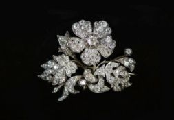A Victorian gold, silver and diamond encrusted floral spray brooch,set with old mine cut stones, (