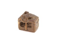 A Japanese boxwood netsuke of a minogame and young perched on the top of a fubako, signed Gyokoku,