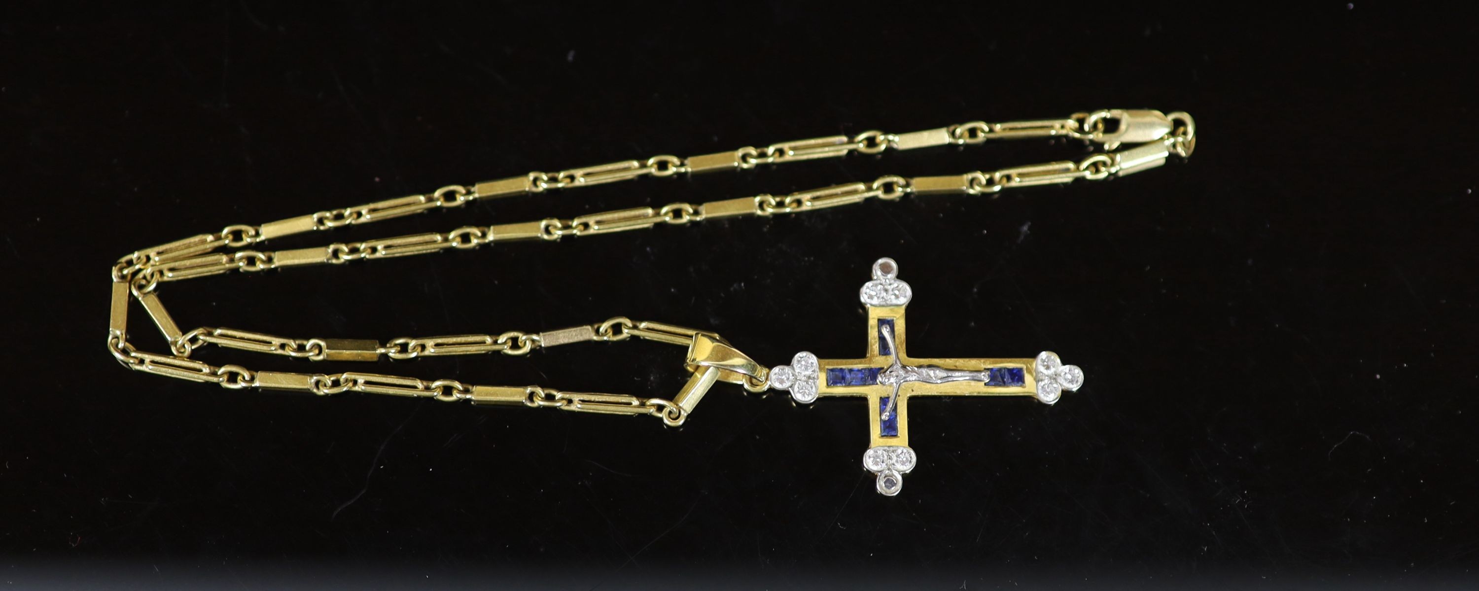 A modern 750 gold, sapphire and diamond set crucifix pendant, on a similar bar link chain,pendant - Image 3 of 3