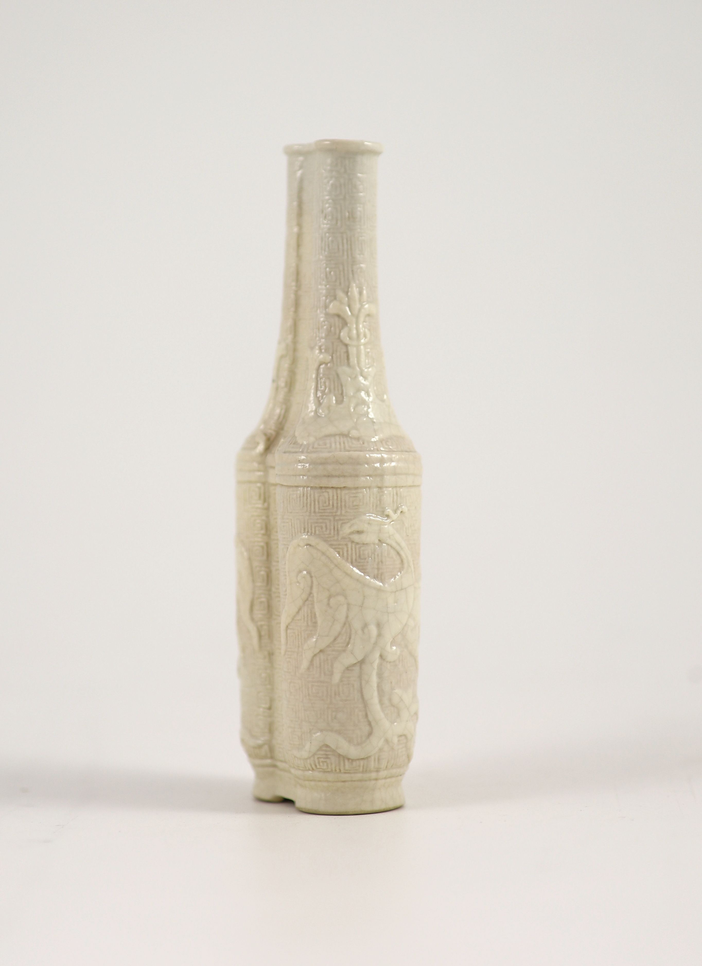 A small Chinese moulded and slip-decorated porcelain double-sided vase, Qianlong mark and period ( - Image 2 of 3