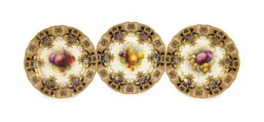 Three Royal Worcester fruit painted dessert plates, signed A. Shuck and E. Phillips, c.1918,each