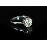 A platinum and solitaire diamond ring,the round brilliant cut stone weighing approximately 2.25ct,