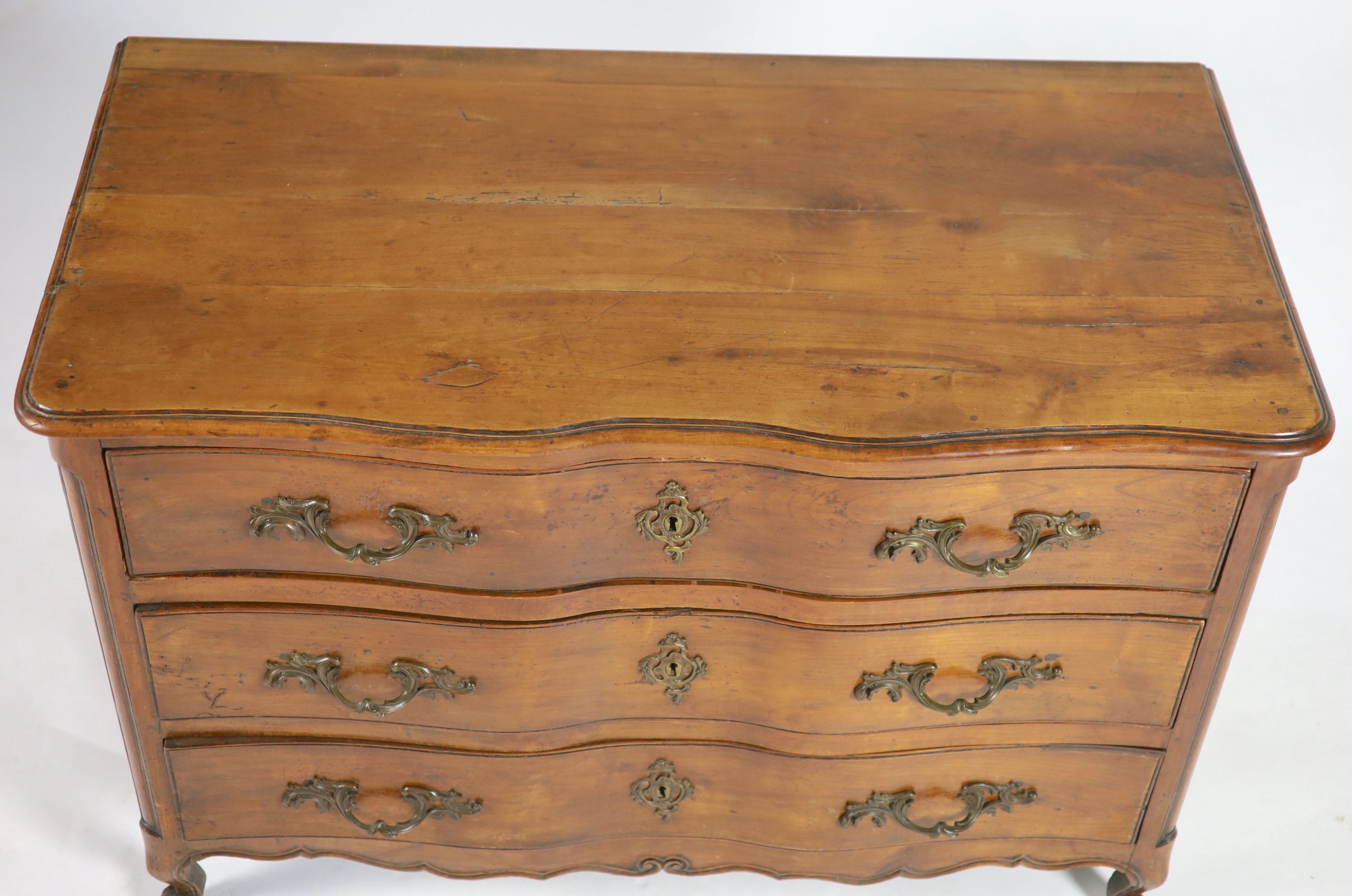 A Louis XV chestnut serpentine chest of three drawers, dated 1776,fitted three long drawers on - Image 3 of 4