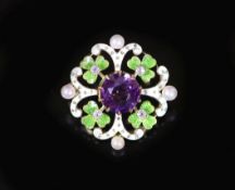 An early 20th century pierced gold, amethyst, seed pearl, green and white enamel set circular