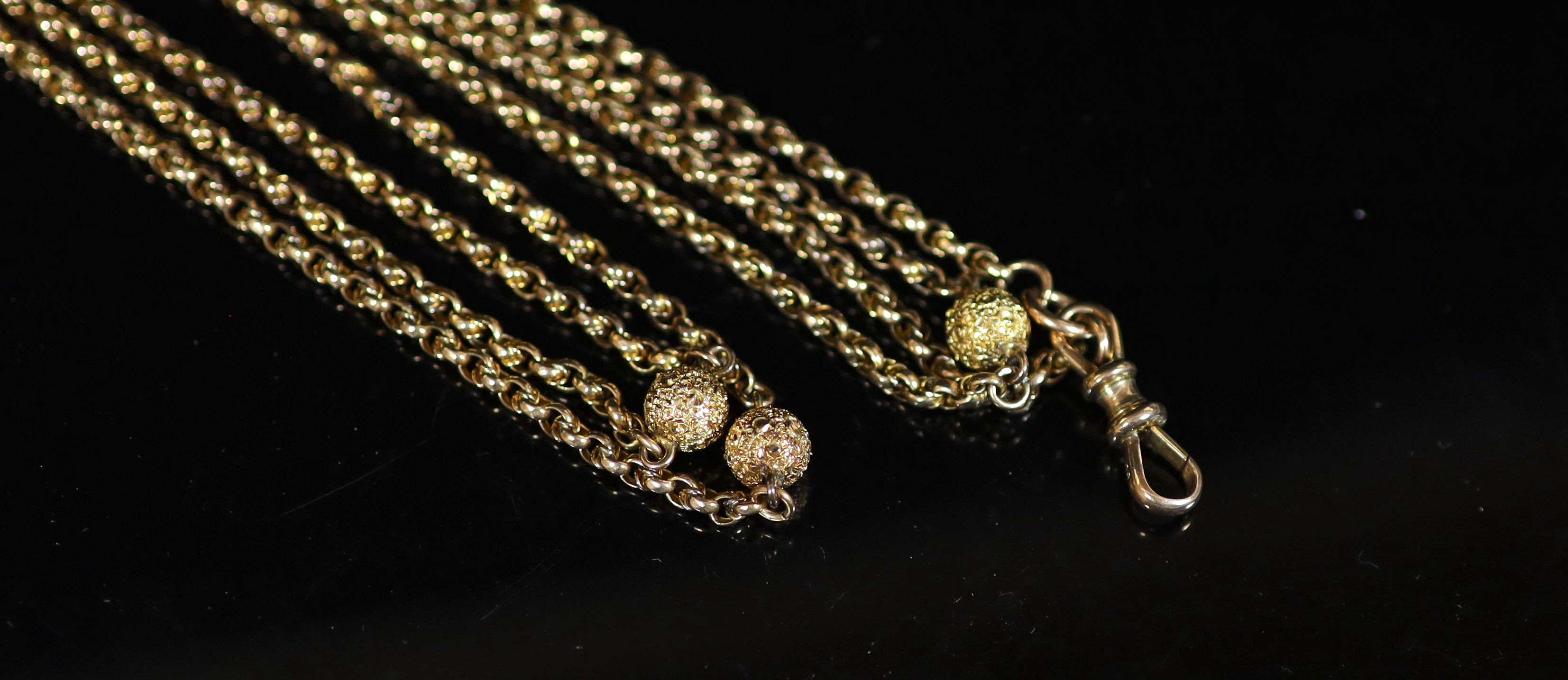 A 19th century 9ct gold guard chain with seven engraved spheres, 124cm,124cm, 27.2 grams. - Image 2 of 3