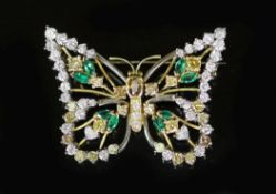 A modern white and yellow gold, diamond, emerald and citrine set open work butterfly brooch,diameter
