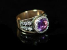 An antique gold, diamond and amethyst cluster ringset with a central foiled amethyst within a border
