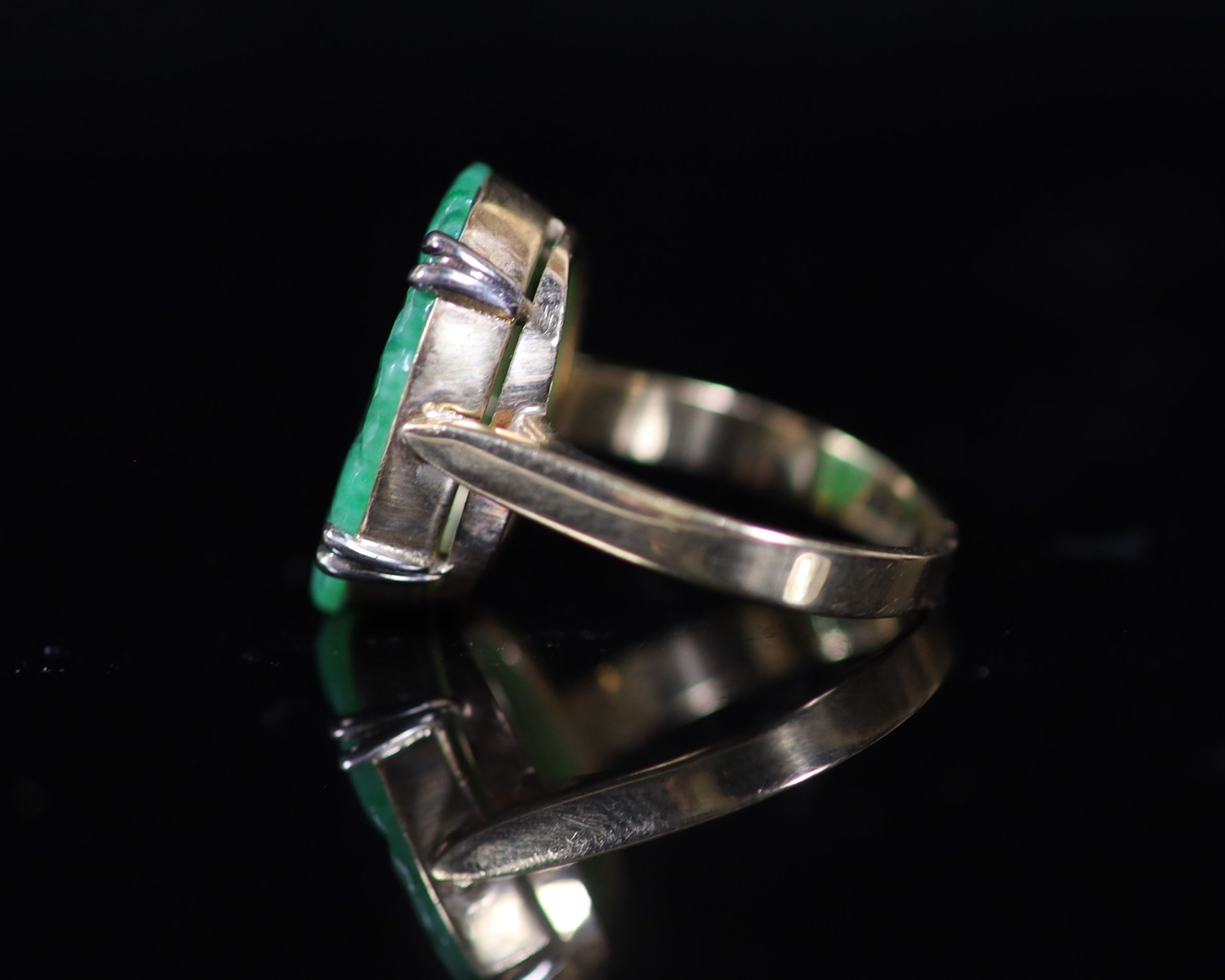 A mid 20th century gold and carved oval jade set dress ring,size O, gross 5.9 grams. - Image 3 of 4