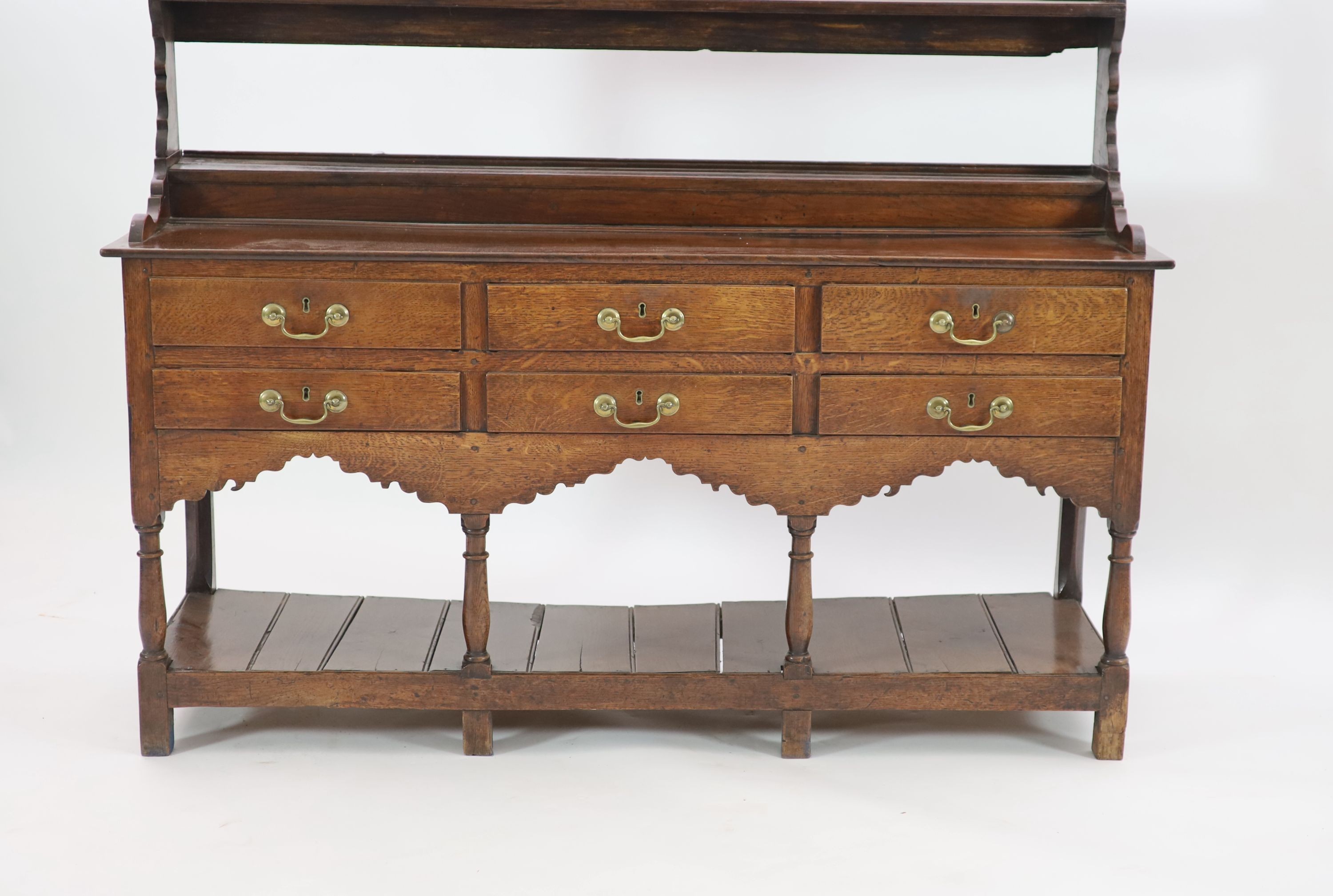 A George III oak dresser,with two shelf rack and six long drawers over a pot board, on stile feet, - Image 2 of 2