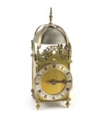 A 17th century style brass lantern clockwith single hand and silvered Roman chapter ring, with