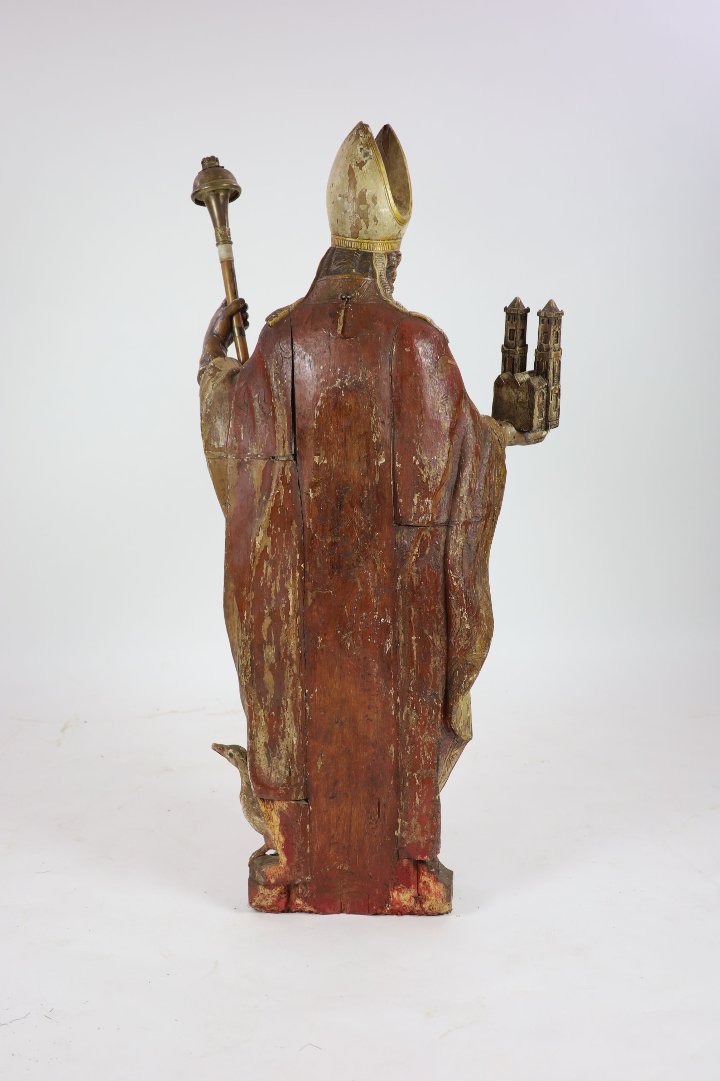 A 19th century German painted carved wood figure of St Ludgerus (b.742)standing holding a - Image 6 of 6