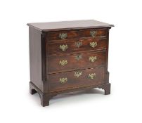 A George III mahogany chestof two short and three graduated long drawers flanked by fluted quarter