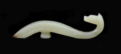 A Chinese pale celadon and brown jade belt hook,with dragon’s head terminal,9 cm long