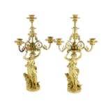 A pair French ormolu four light candelabrawith scrolling foliate branches supported by female