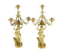 A pair French ormolu four light candelabrawith scrolling foliate branches supported by female