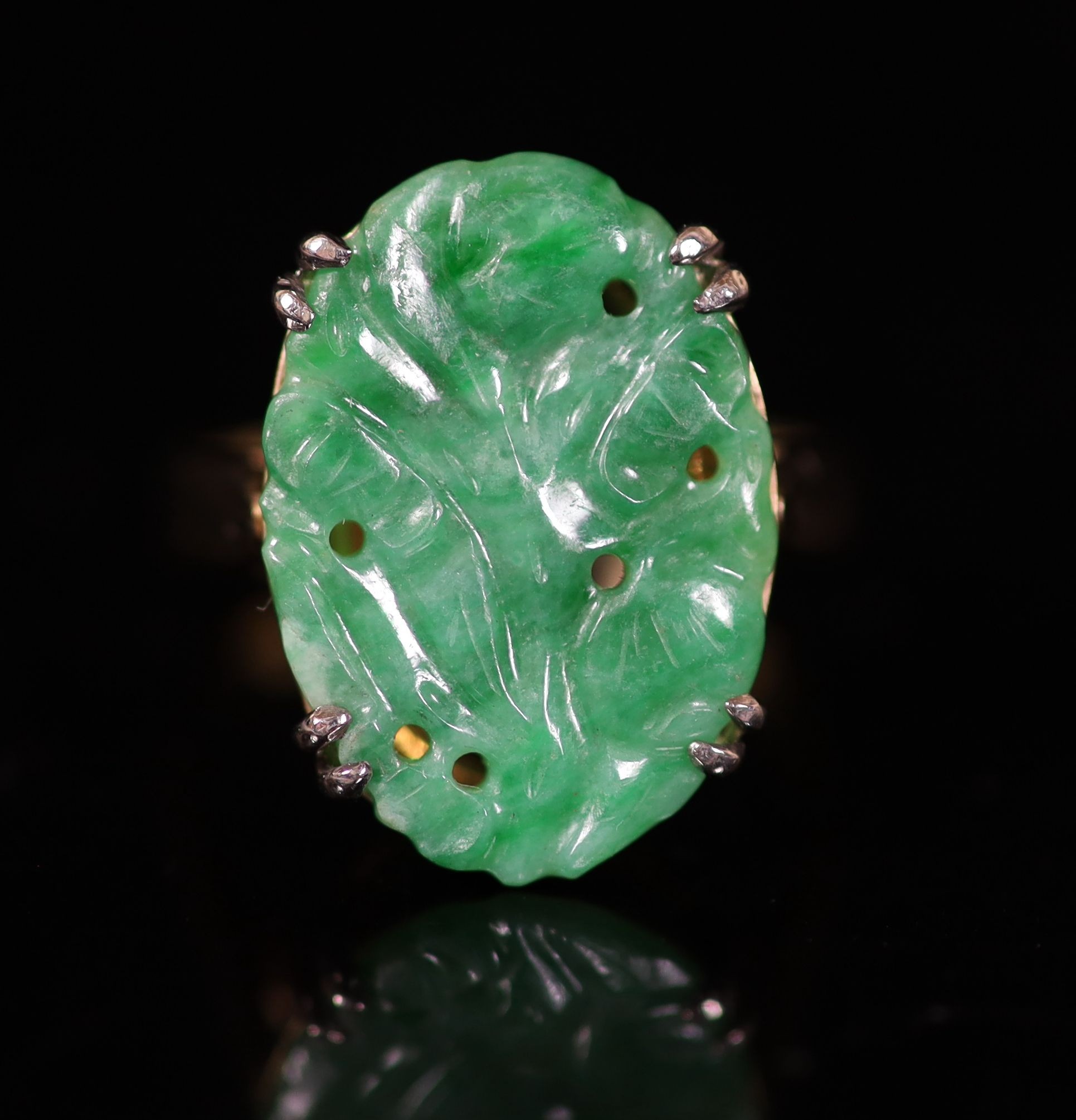 A mid 20th century gold and carved oval jade set dress ring,size O, gross 5.9 grams. - Image 2 of 4
