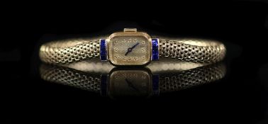 A lady's mid 20th century French Boucheron 18ct gold and six stone sapphire set manual wind cocktail