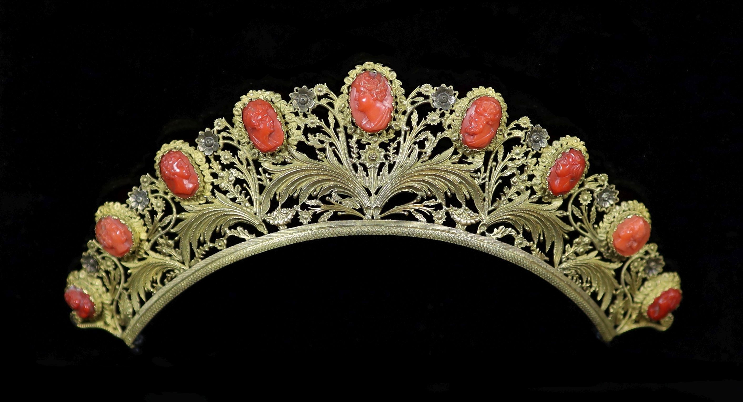 A Regency gilt metal/pinchbeck and graduated nine stone coral set tiara,each coral carved with the