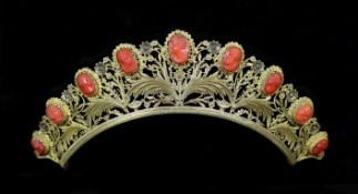 A Regency gilt metal/pinchbeck and graduated nine stone coral set tiara,each coral carved with the