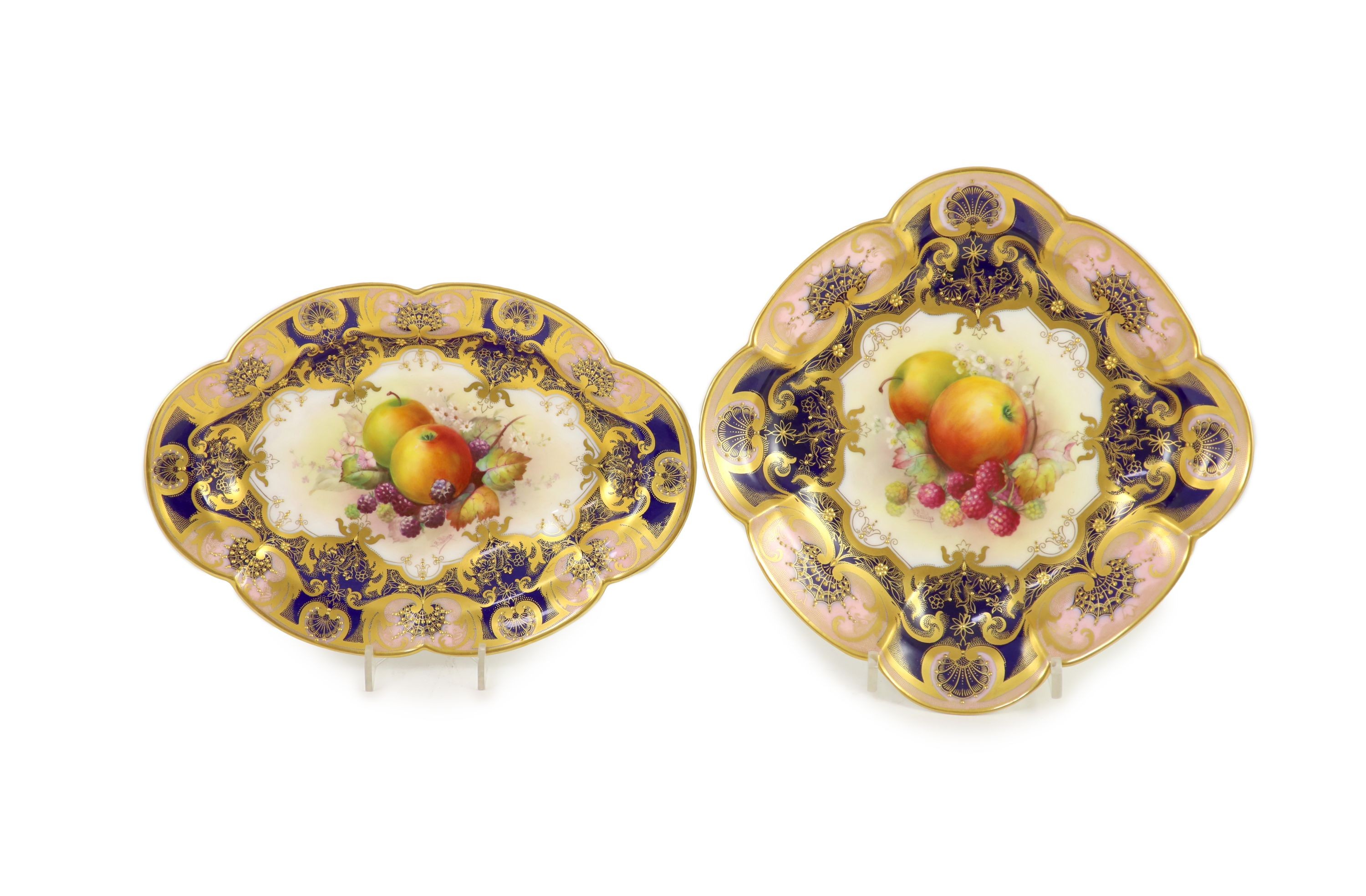 Two Royal Worcester fruit painted dessert dishes, signed E. Phillips, c.1918,each within gilt-