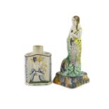 A Staffordshire Prattware pearlware tea caddy and figure of Flora, c.1790,the tea caddy moulded with