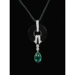 A French Art Deco style platinum, black onyx, diamond and pear cut cabochon emerald set drop