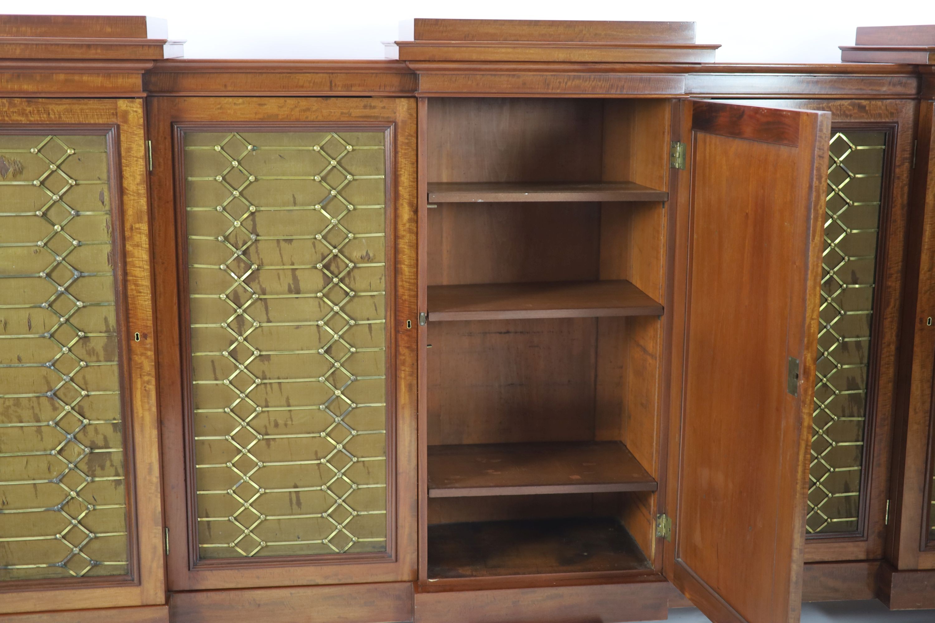 An early Victorian flame mahogany triple breakfront library cabinet,fitted five brass grilled - Image 3 of 4