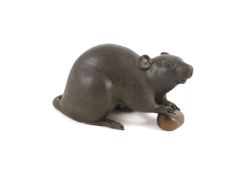 A Japanese two colour bronze figure of a rat, Meiji period, signed Seishu,the rat holding a chestnut