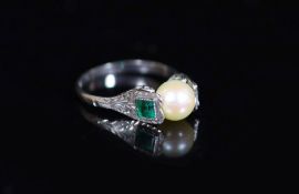 A mid 20th century white gold, cultured pearl and emerald set three stone ring,size N, gross 2