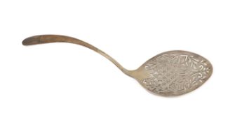 An 18th century Irish pierced silver fish serving ladle, maker W.T., marks rubbed, 30.2cm, 99