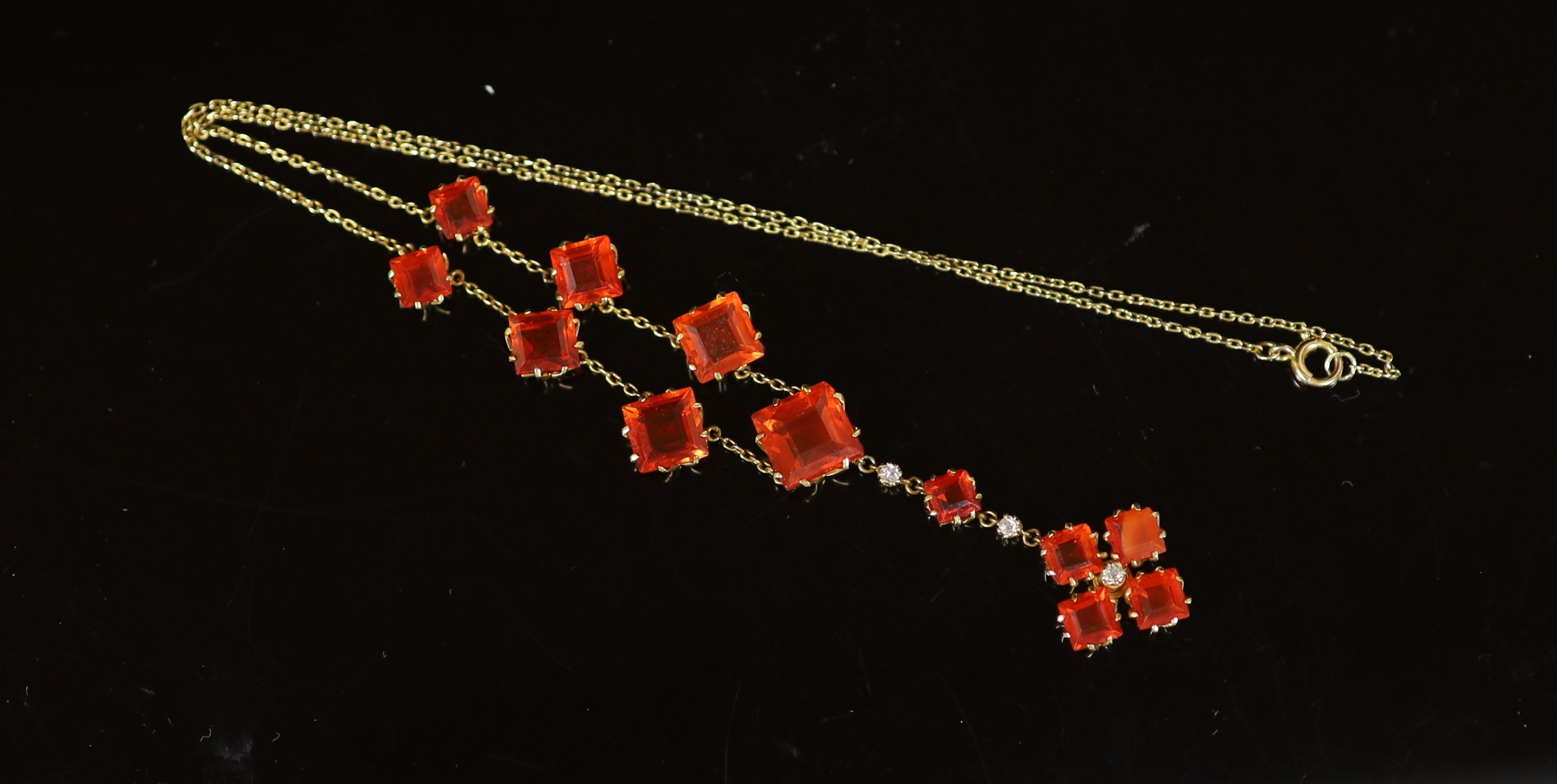 An early 20th century gold, fire opal and diamond drop necklace,set with twelve square cut opals ( - Image 2 of 2