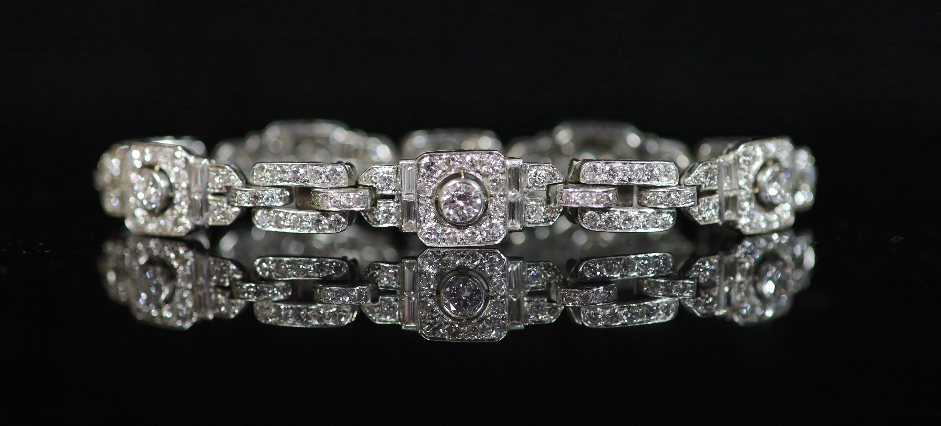 A mid 20th century platinum and diamond encrusted rectangular link bracelet,set with round and