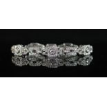A mid 20th century platinum and diamond encrusted rectangular link bracelet,set with round and
