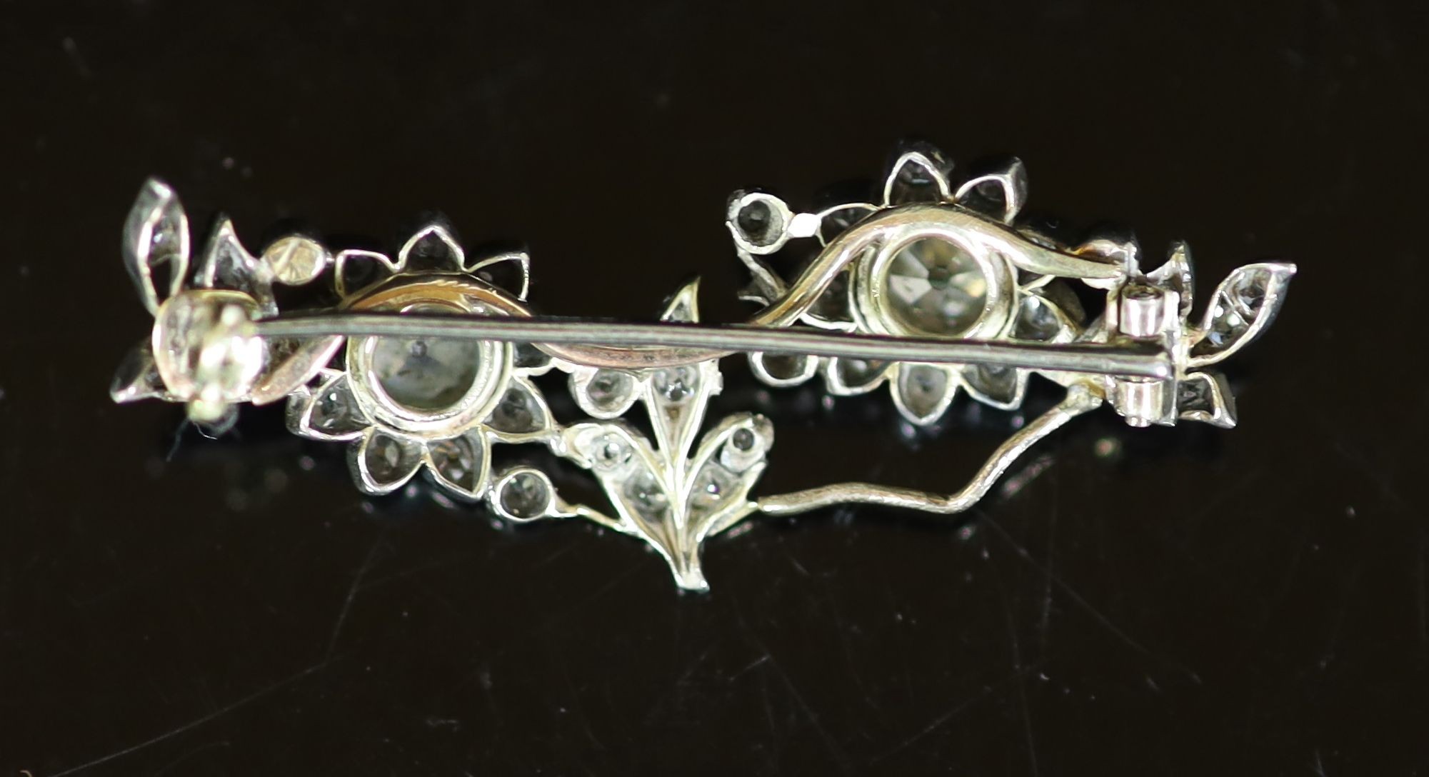 A late Victorian gold, silver and diamond cluster set foliate broochthe two largest diamonds - Image 2 of 2