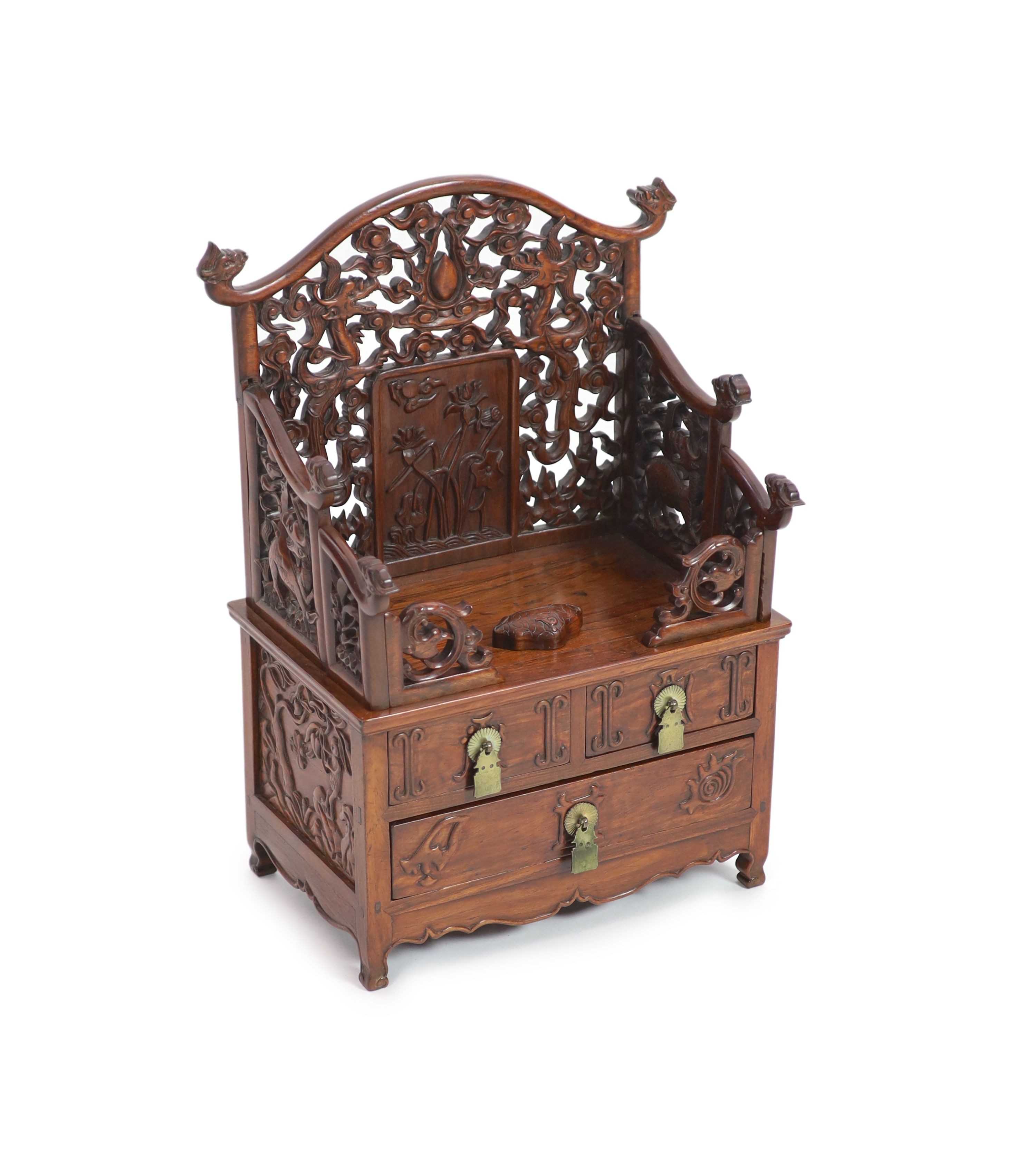 A fine Chinese huanghuali table cabinet, early Qing dynasty, 17th/18th century,the pierced