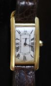 A lady's French 18ct gold Cartier Tank Americaine manual wind wrist watch,on a gold mountedCartier