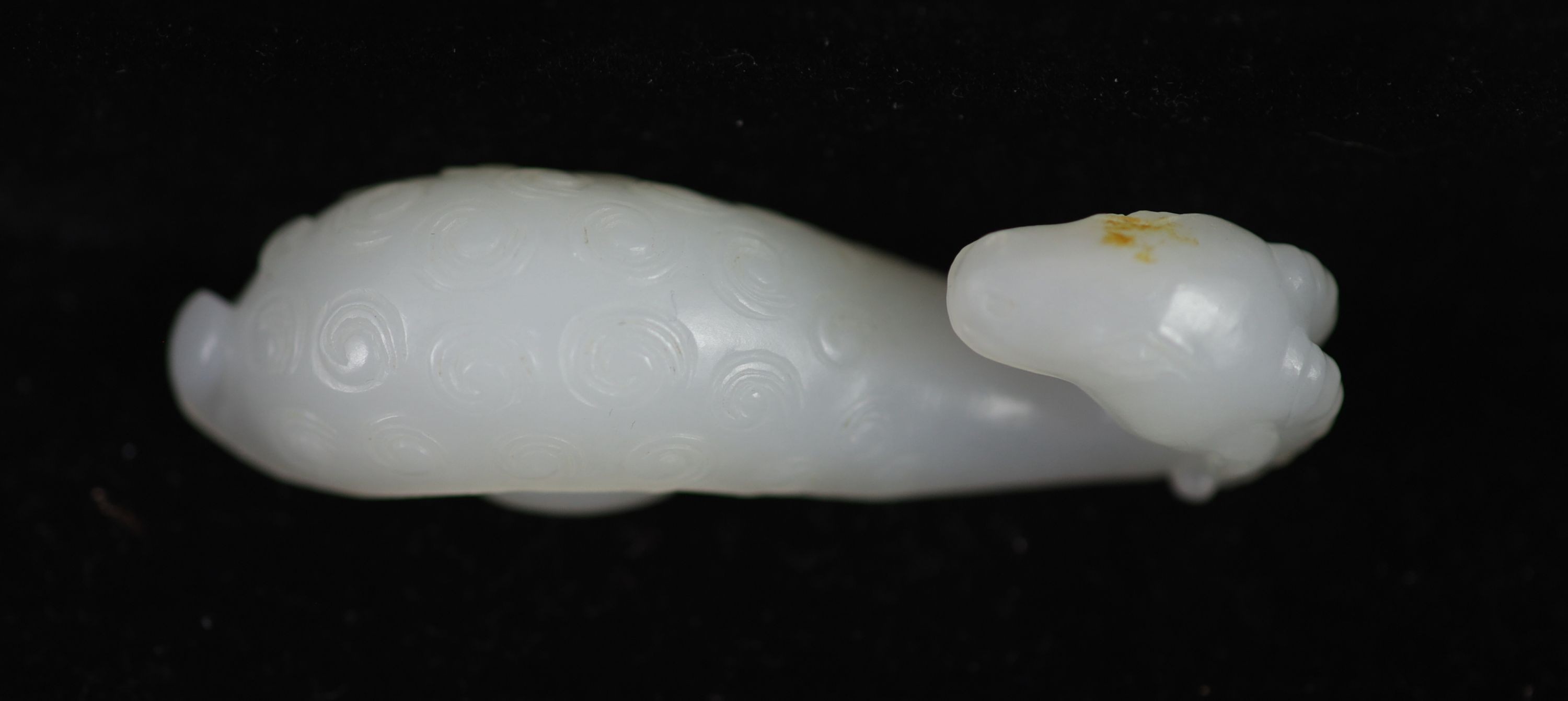 A Chinese white jade 'ram’s head’ belt hook,the scrolled belt hook carved in relief with tight - Image 2 of 3
