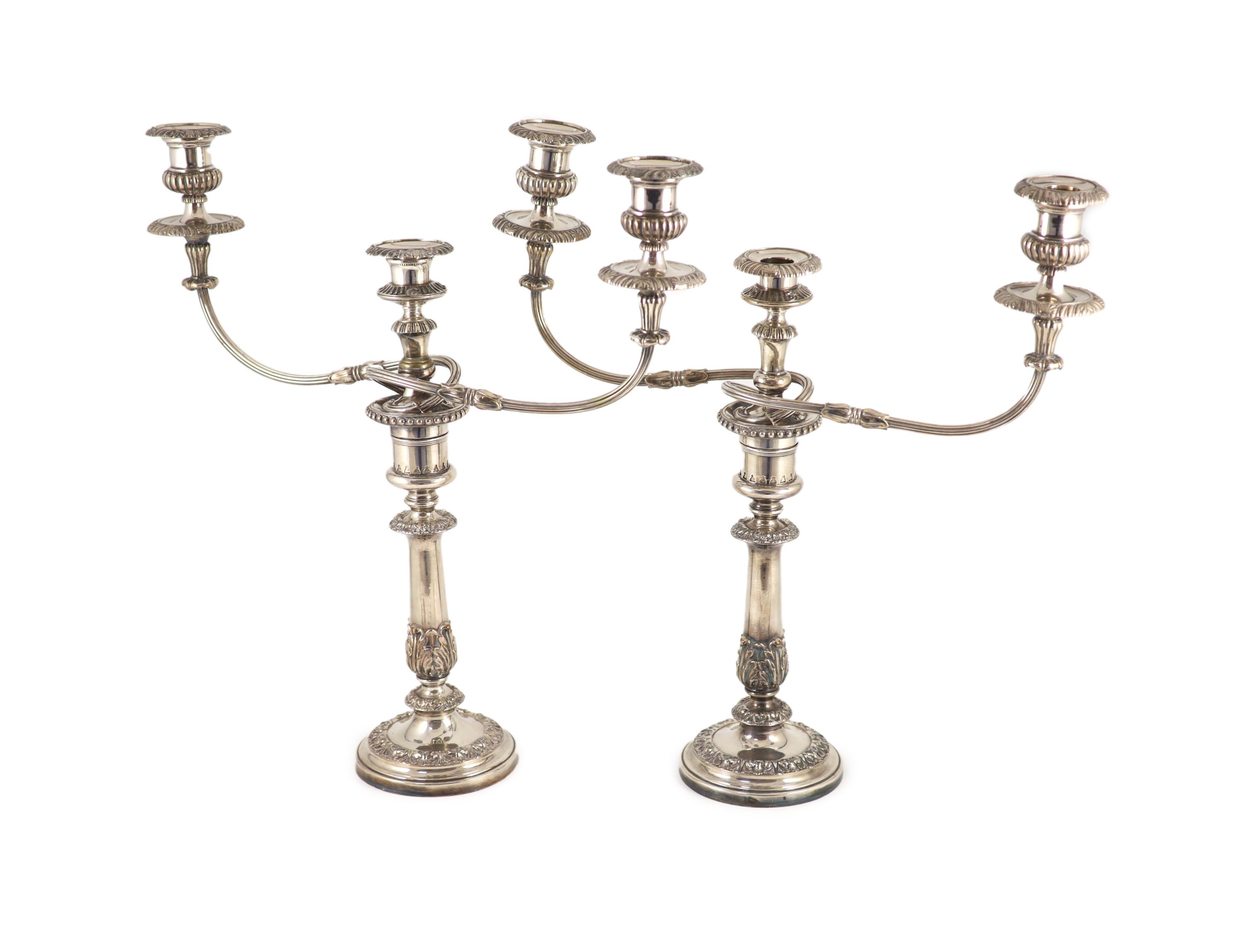 A pair of early to mid 20th century silver plated three light, two branch candelabra,with reeded