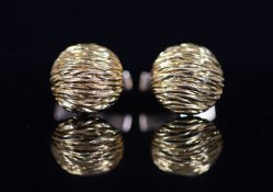 A modern pair of Kutchinsky 18ct gold cufflinks,of textured circular domed form, signed, diameter