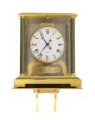 A Jaeger le Coultre gilt brass Atmos clock,with fluted columns and white enamelled Roman and