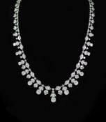 A modern continental 18k white gold and diamond cluster set drop fringe necklace,the clusters of