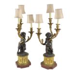 A pair of 19th century French bronze and ormolu three light candelabra, after Clodionmodelled as
