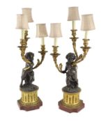 A pair of 19th century French bronze and ormolu three light candelabra, after Clodionmodelled as