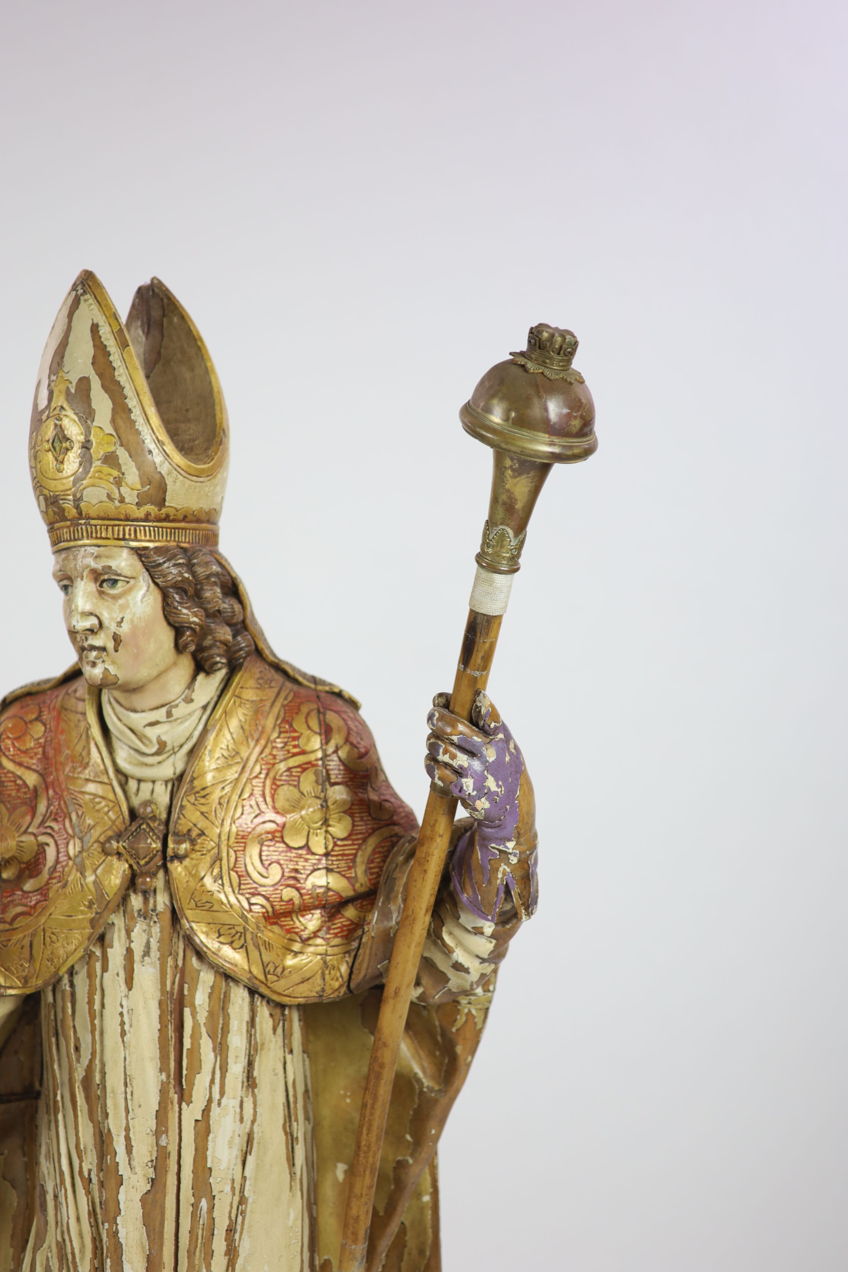 A 19th century German painted carved wood figure of St Ludgerus (b.742)standing holding a - Image 4 of 6
