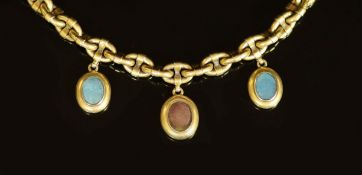 A Victorian gold oval link memorial bracelet, hung with three engraved oval charms, with glazed
