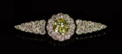 A good early 20th century gold and silver, single stone fancy yellow diamond and old mine cut