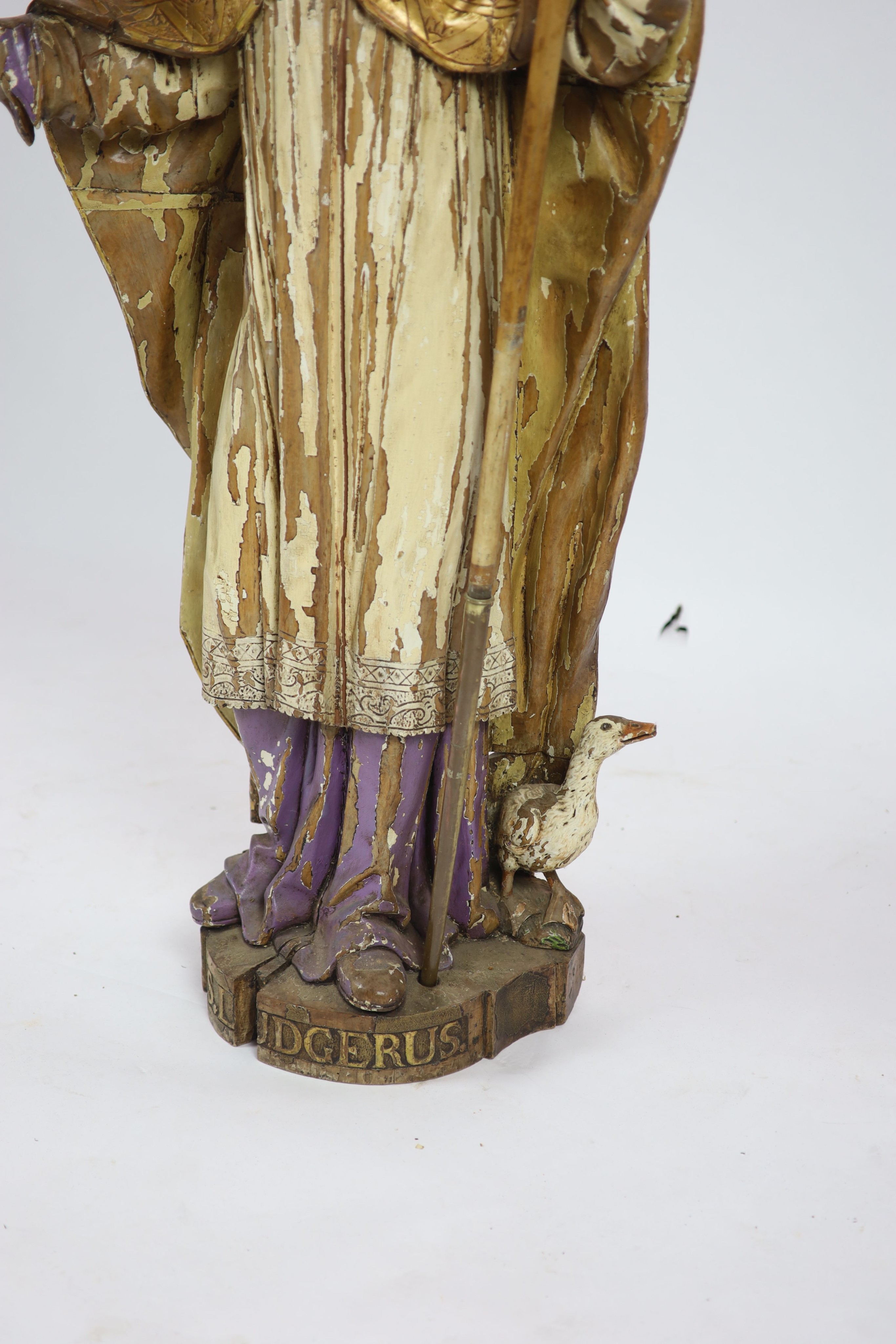 A 19th century German painted carved wood figure of St Ludgerus (b.742)standing holding a - Image 5 of 6